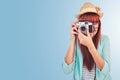 Composite image of portrait of a smiling hipster woman holding retro camera Royalty Free Stock Photo