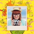 Composite image of portrait of a smiling hipster woman holding retro camera Royalty Free Stock Photo