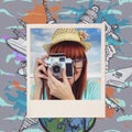 Composite image of portrait of a smiling hipster woman holding retro camera Royalty Free Stock Photo