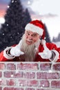 Composite image of portrait of smiling santa claus gesturing Royalty Free Stock Photo