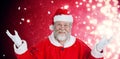 Composite image of portrait of smiling santa claus gesturing Royalty Free Stock Photo