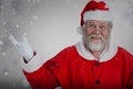 Composite image of portrait of smiling santa claus gesturing Royalty Free Stock Photo