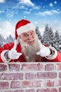 Composite image of portrait of smiling santa claus gesturing Royalty Free Stock Photo