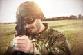 Composite image of portrait of soldier aiming with rifle Royalty Free Stock Photo