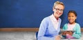 Composite image of portrait of student with teacher holding digital tablet Royalty Free Stock Photo