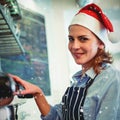 Composite image of portrait of waitress using coffee maker at cafeteria during christmas