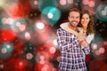 Composite image of portrait of young couple smiling Royalty Free Stock Photo