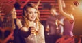 Composite image of portrait of young woman holding glass of champagne Royalty Free Stock Photo