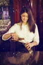 Composite image of pretty bartender preparing drink