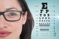 Composite image of pretty brunette wearing eye glasses Royalty Free Stock Photo