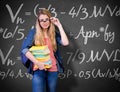 Composite image of pretty student in the library Royalty Free Stock Photo