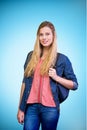 Composite image of pretty student in the library Royalty Free Stock Photo