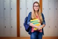 Composite image of pretty student in the library Royalty Free Stock Photo