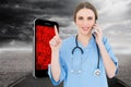 Composite image of pretty woman doctor phoning and pointing with her finger Royalty Free Stock Photo