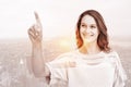 Composite image of pretty woman pointing with her finger Royalty Free Stock Photo