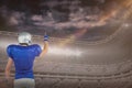 Composite image of rear view of american football player pointing Royalty Free Stock Photo