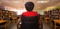 Composite image of rear view of boy sitting in wheelchair Royalty Free Stock Photo