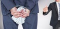 Composite image of rear view of businessman with handcuff and money Royalty Free Stock Photo