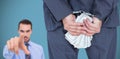 Composite image of rear view of businessman with handcuff and money Royalty Free Stock Photo