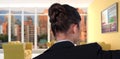 Composite image of rear view of businesswoman using digital screen Royalty Free Stock Photo