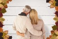 Composite image of rear view of couple with arms around Royalty Free Stock Photo