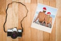 Composite image of rear view of couple sitting on beach Royalty Free Stock Photo