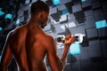 Composite image of rear view of a fit shirtless young man lifting dumbbell Royalty Free Stock Photo