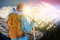 Composite image of rear view of skier with skis carrying backpack Royalty Free Stock Photo