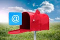 Composite image of red email postbox Royalty Free Stock Photo