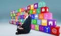 Composite image of redhead businesswoman using her tablet pc Royalty Free Stock Photo