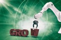 Composite image of robotic arm arranging grow text 3d Royalty Free Stock Photo