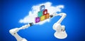 Composite image of robotic hands holding multi colored computer icons over blue vignette