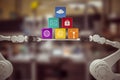 Composite image of robotic hands holding multi colored computer icons over white background