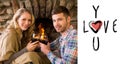 Composite image of romantic couple toasting wineglasses in front of lit fireplace Royalty Free Stock Photo