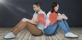 Composite image of sad couple holding broken heart pieces Royalty Free Stock Photo