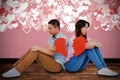 Composite image of sad couple holding broken heart pieces Royalty Free Stock Photo