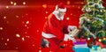 Composite image of santa claus arranging presents near christmas tree Royalty Free Stock Photo