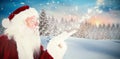 Composite image of santa claus blowing Royalty Free Stock Photo