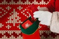 Composite image of santa claus putting presents in christmas stockings Royalty Free Stock Photo