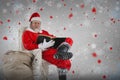 Composite image of santa claus reading bible with sack of christmas presents Royalty Free Stock Photo