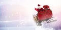 Composite image of santa claus riding on sled with gift box Royalty Free Stock Photo