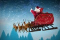 Composite image of santa claus riding on sleigh during christmas Royalty Free Stock Photo