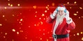 Composite image of santa claus showing hand okay sign while listening to music on headphones Royalty Free Stock Photo