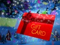 Composite image of santa flying his sleigh behind gift card