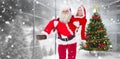 Composite image of santa and mrs claus smiling at camera Royalty Free Stock Photo