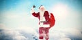 Composite image of santa ringing his bell