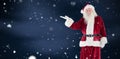 Composite image of santa shows something to camera Royalty Free Stock Photo