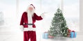 Composite image of santa shows something to camera Royalty Free Stock Photo