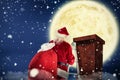 Composite image of santa steps up a ladder Royalty Free Stock Photo
