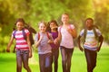 Composite image of school kids running in school corridor Royalty Free Stock Photo